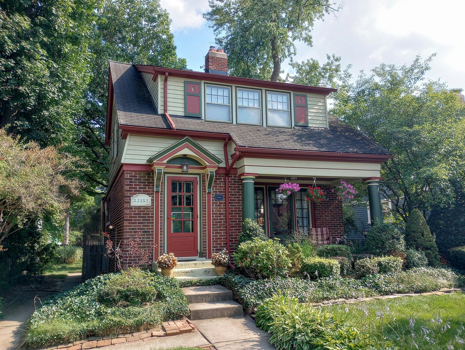 Brick house with a red front door, representing a home we would visit for a direct-owner conversation